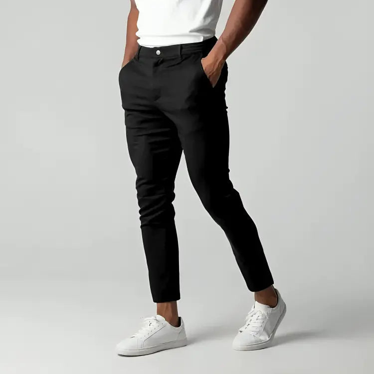 Men's slim fit chinos worn front-facing, showing tailored silhouette and straight leg line
