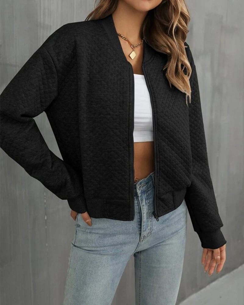 Women's quilted jacket with zipper showing rib-knitted hem detail