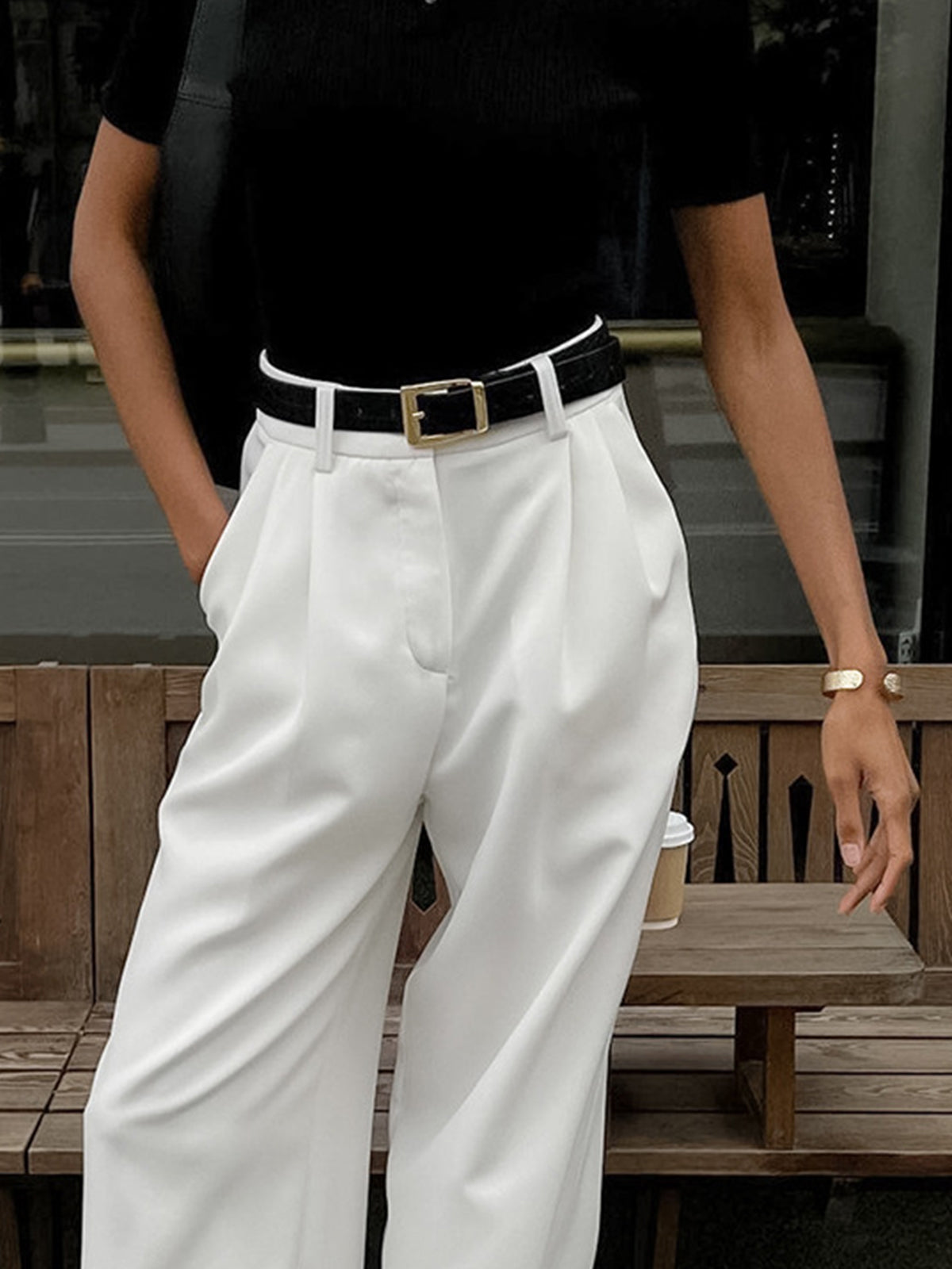 Full-length back view of women's high-waisted wide-leg trousers