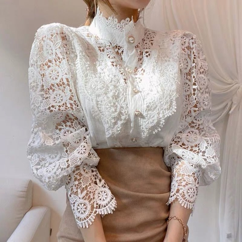 Women's long-sleeve lace blouse with high collar and button closure in a light tone