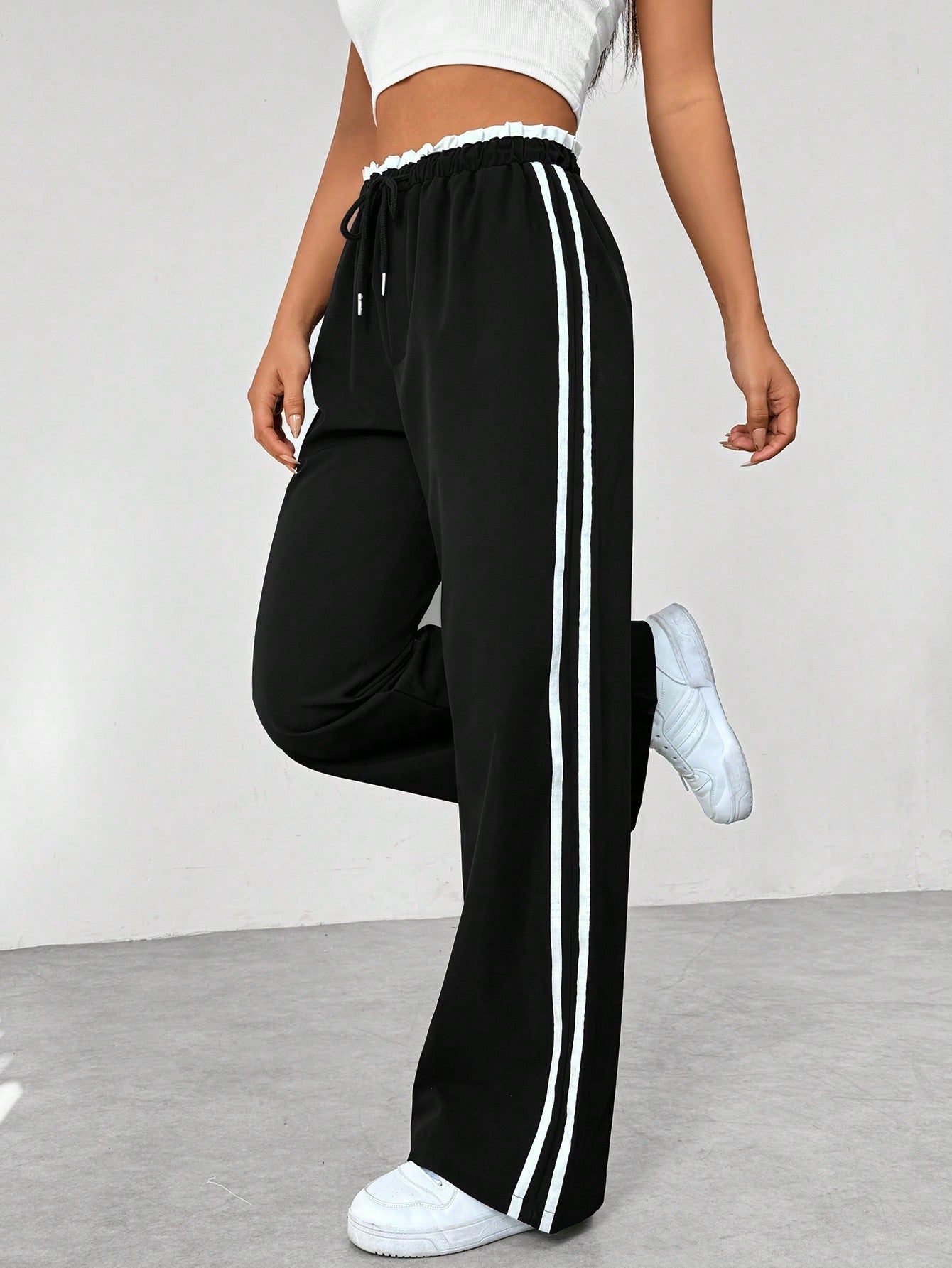 Women's wide-leg sweatpants with elastic drawstring waist, side profile