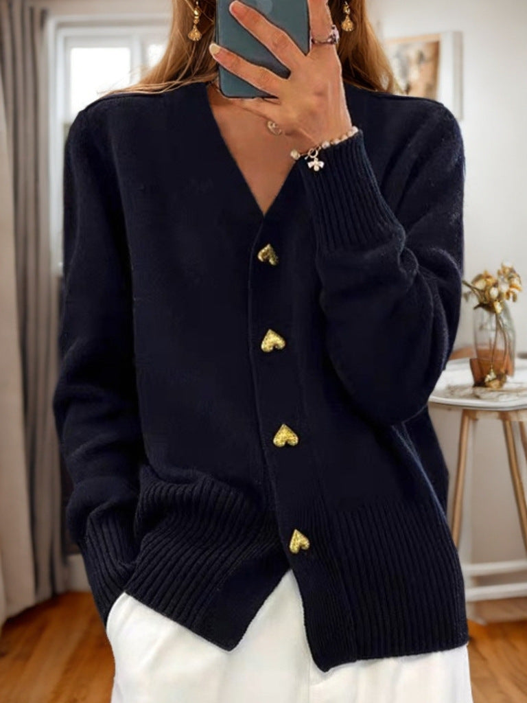 Fine-knit women's cardigan with structured button closure and ribbed trim, front-facing