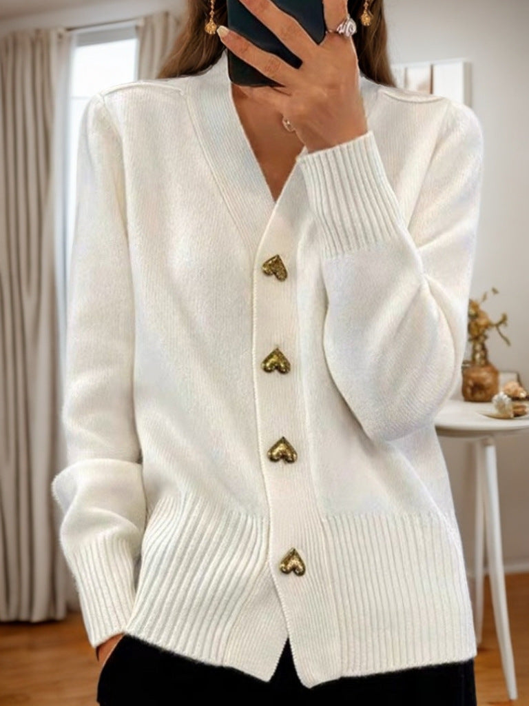 Women's fine-knit button cardigan with V-neck and ribbed edges, layering style
