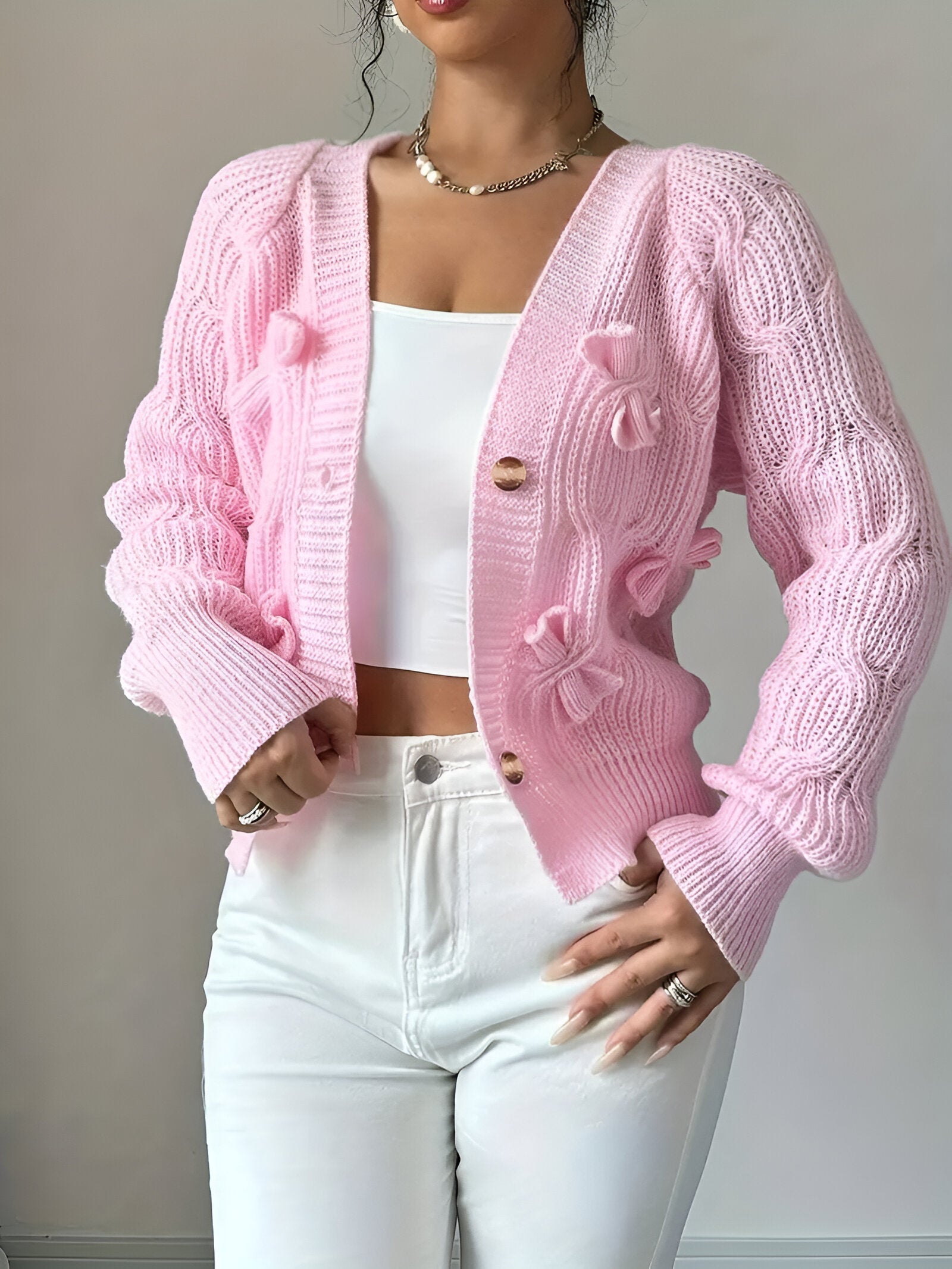 Women's knitted cardigan with button closure, full-length view