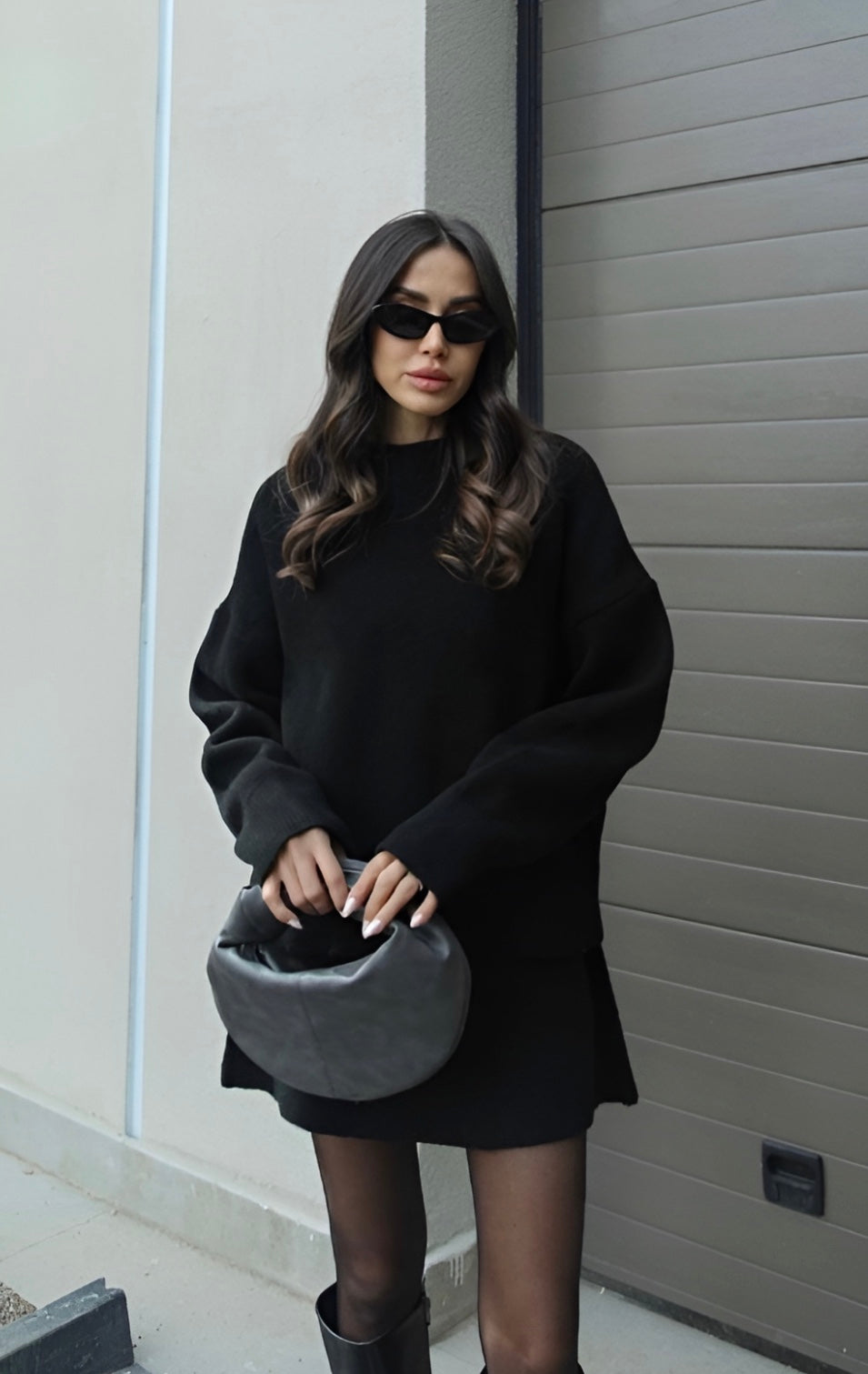 Women's cozy knitted matching set with loose sweater and mini skirt, detail or back view