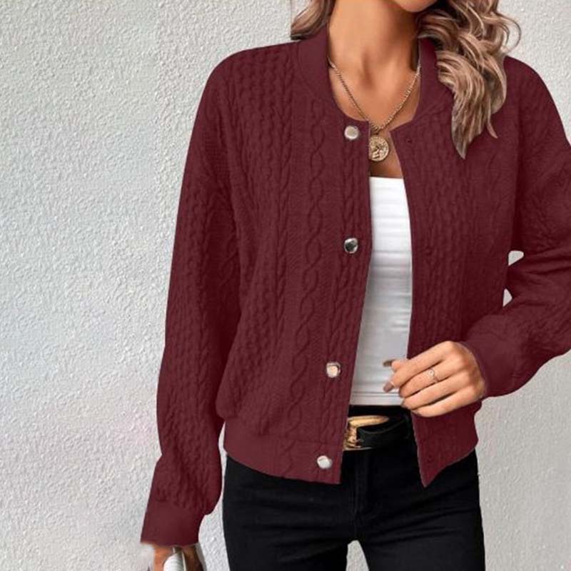 Women's cable knit cardigan with ribbed hem and long sleeves, styled for everyday wear