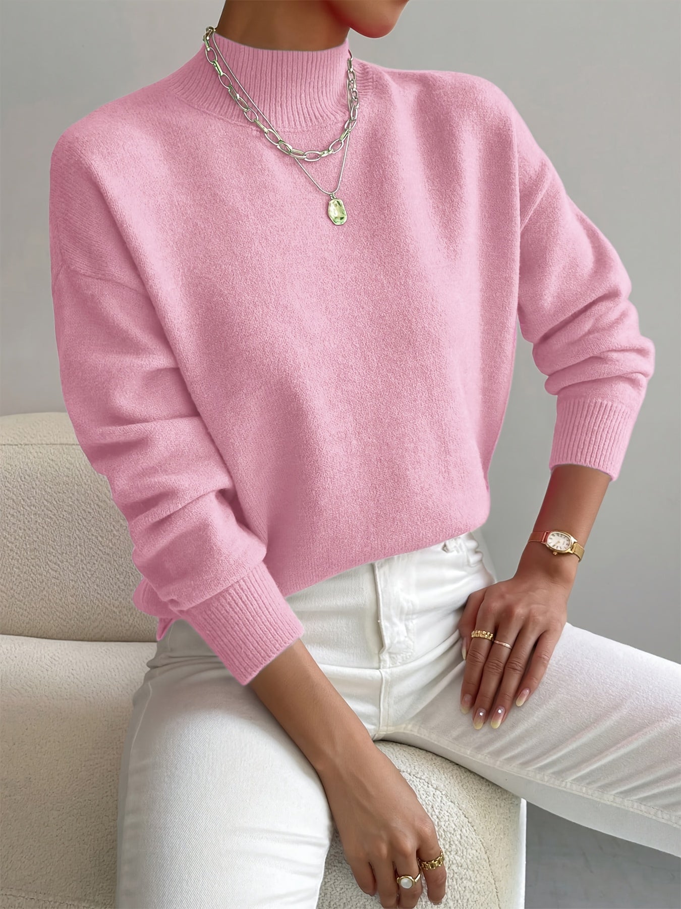 Women's high neck knitted sweater with ribbed hem and relaxed silhouette