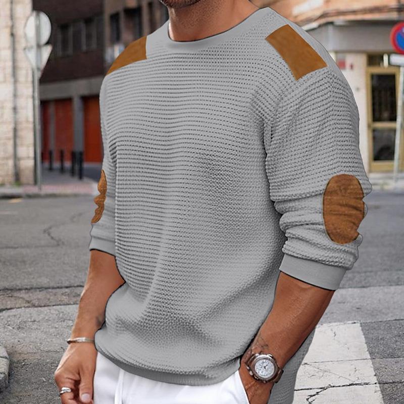 Men's knit sweater full-length view with contrast elbow patches and crew neckline