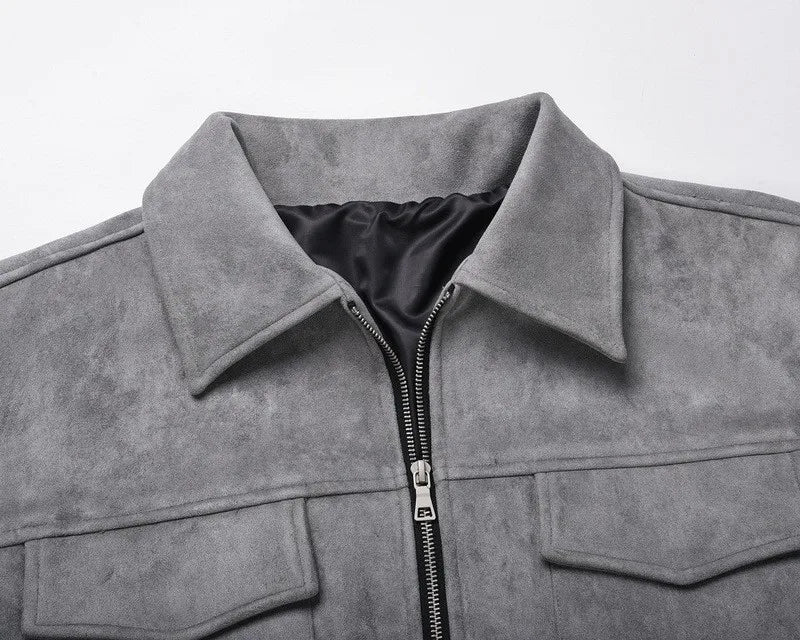 Men's zip-up jacket detail view of chest flap pockets and front zipper – black colorway