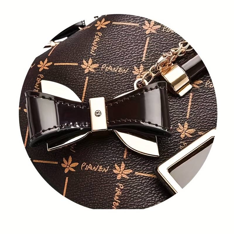 Elegant women's handbag with geometric patterned exterior and detachable shoulder strap