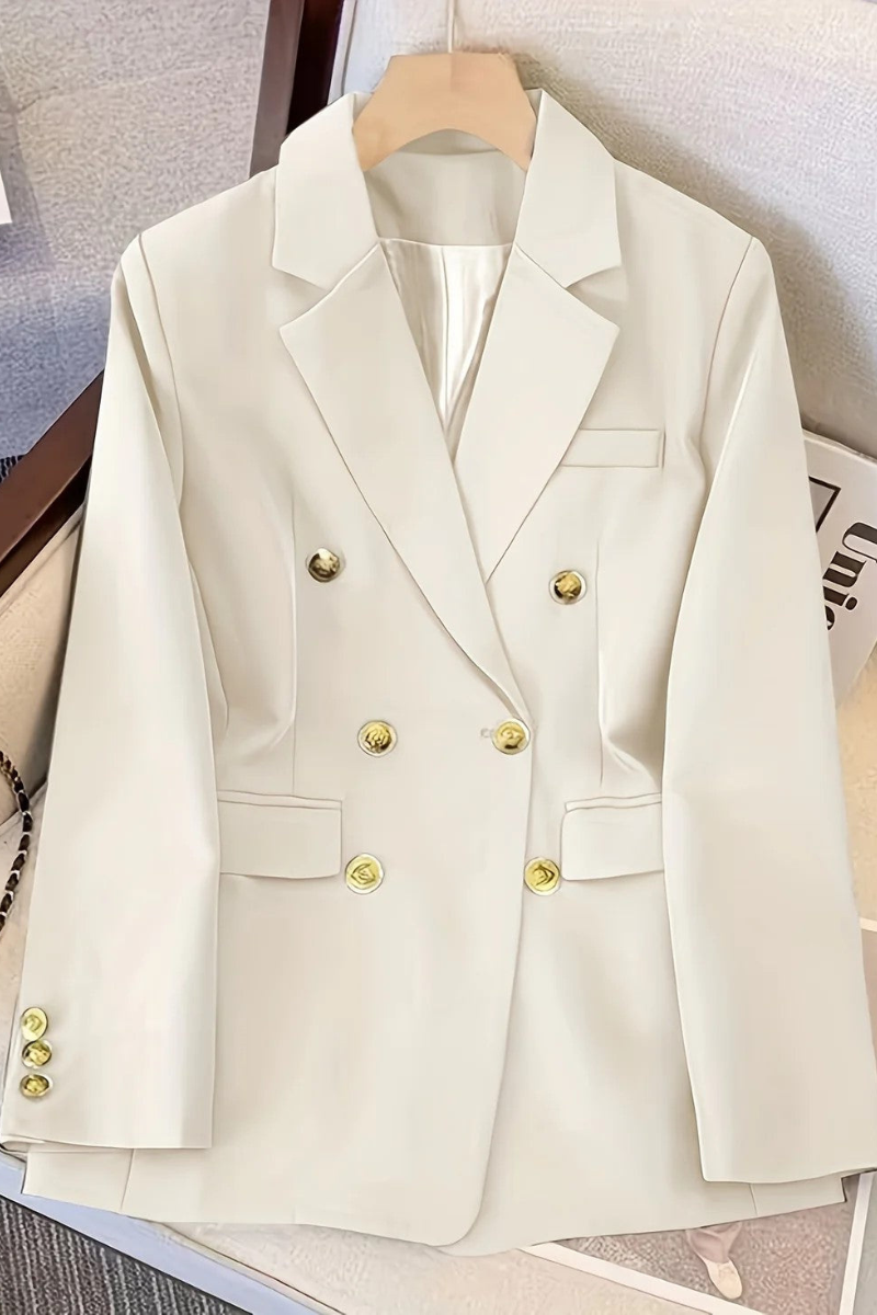 Women's double-breasted blazer with lapel collar and metal buttons, front view
