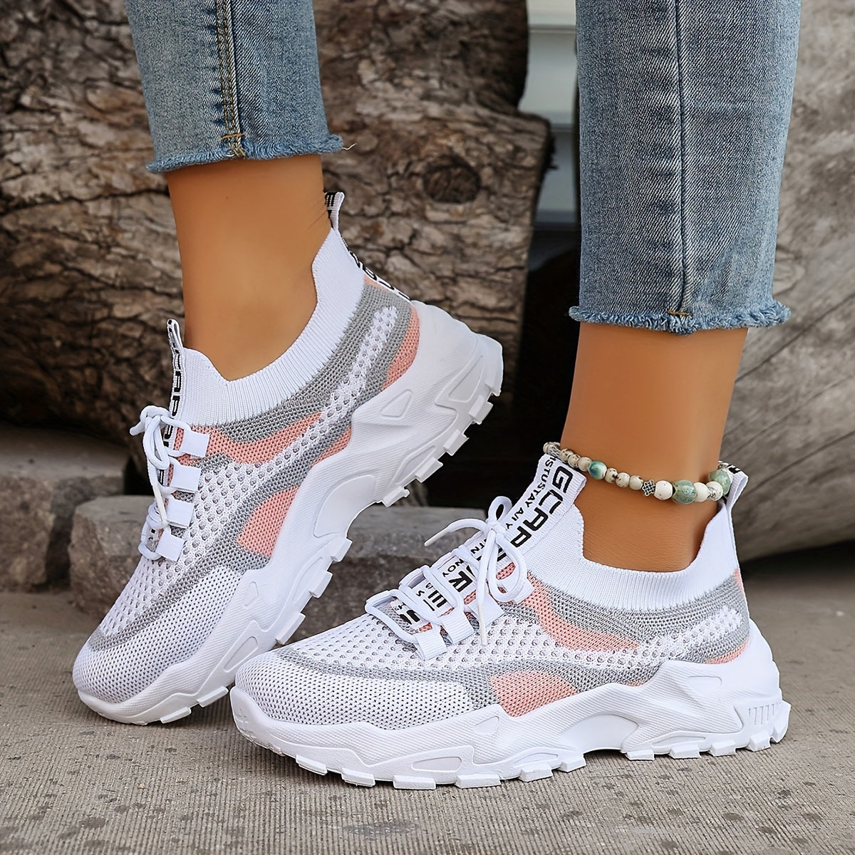 Women's breathable lightweight sneakers with mesh upper and lace-up closure, front view