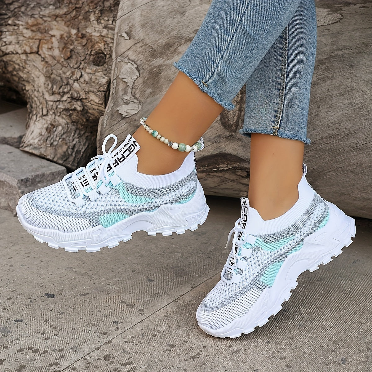 Women's breathable sneakers with knit mesh upper and lace-up design, top-down view