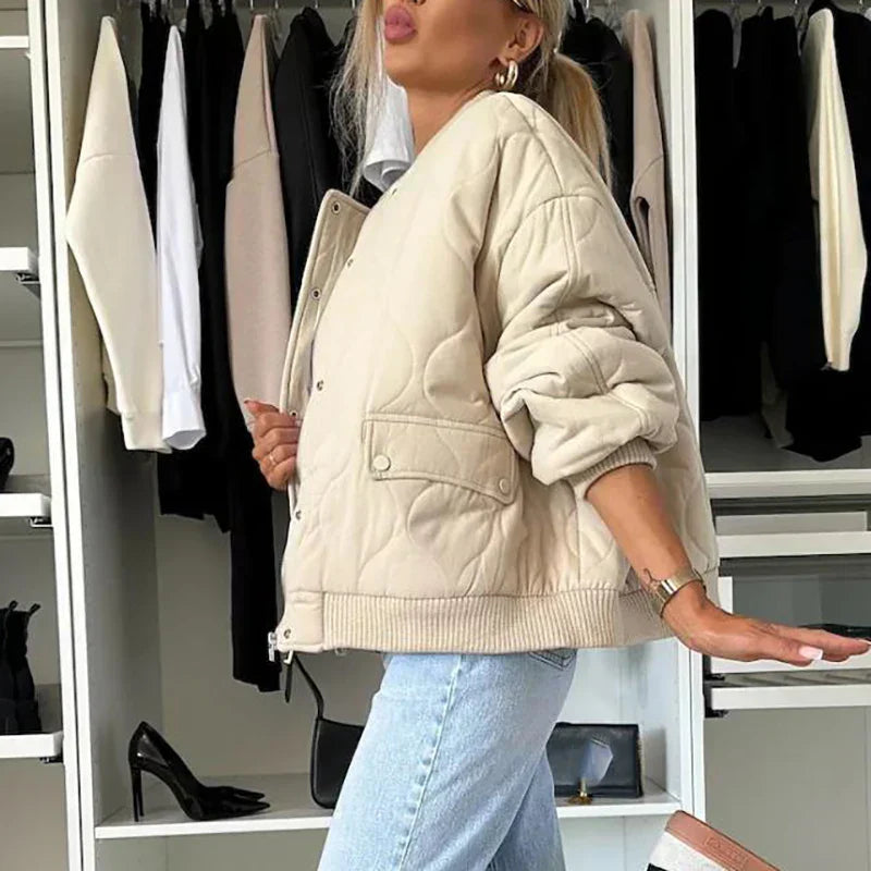Padded women's jacket with round neckline and ribbed hem detail