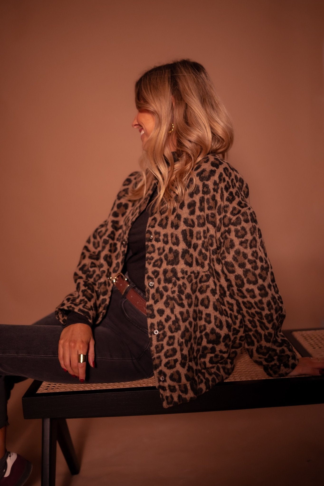 Women's leopard print jacket back view, hip-length silhouette
