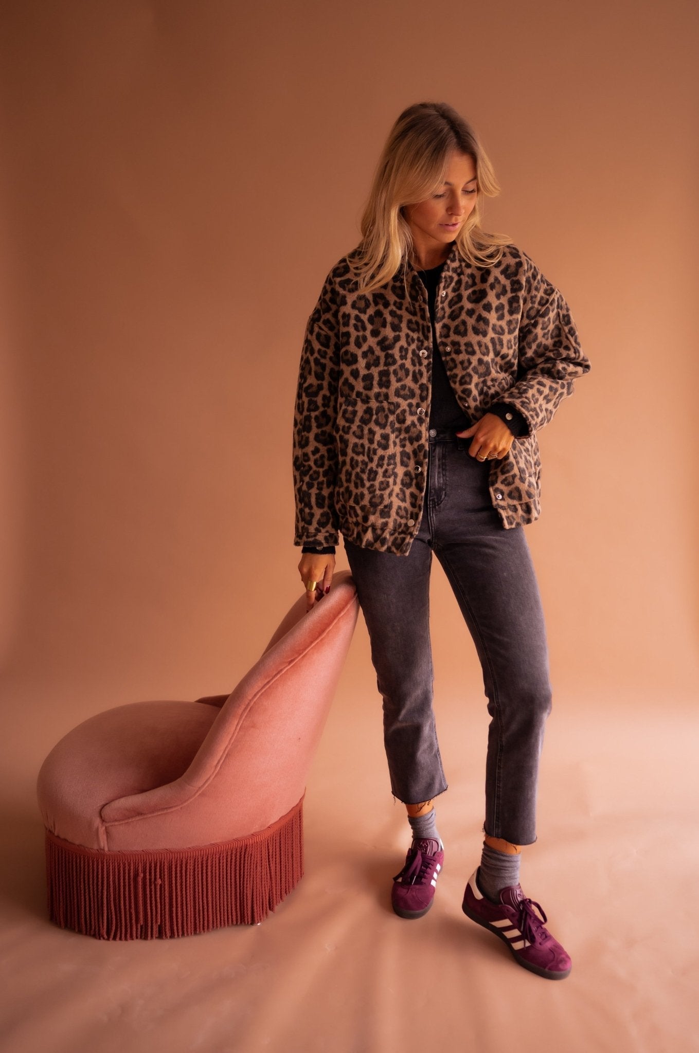 Women's leopard print jacket three-quarter front angle highlighting print pattern