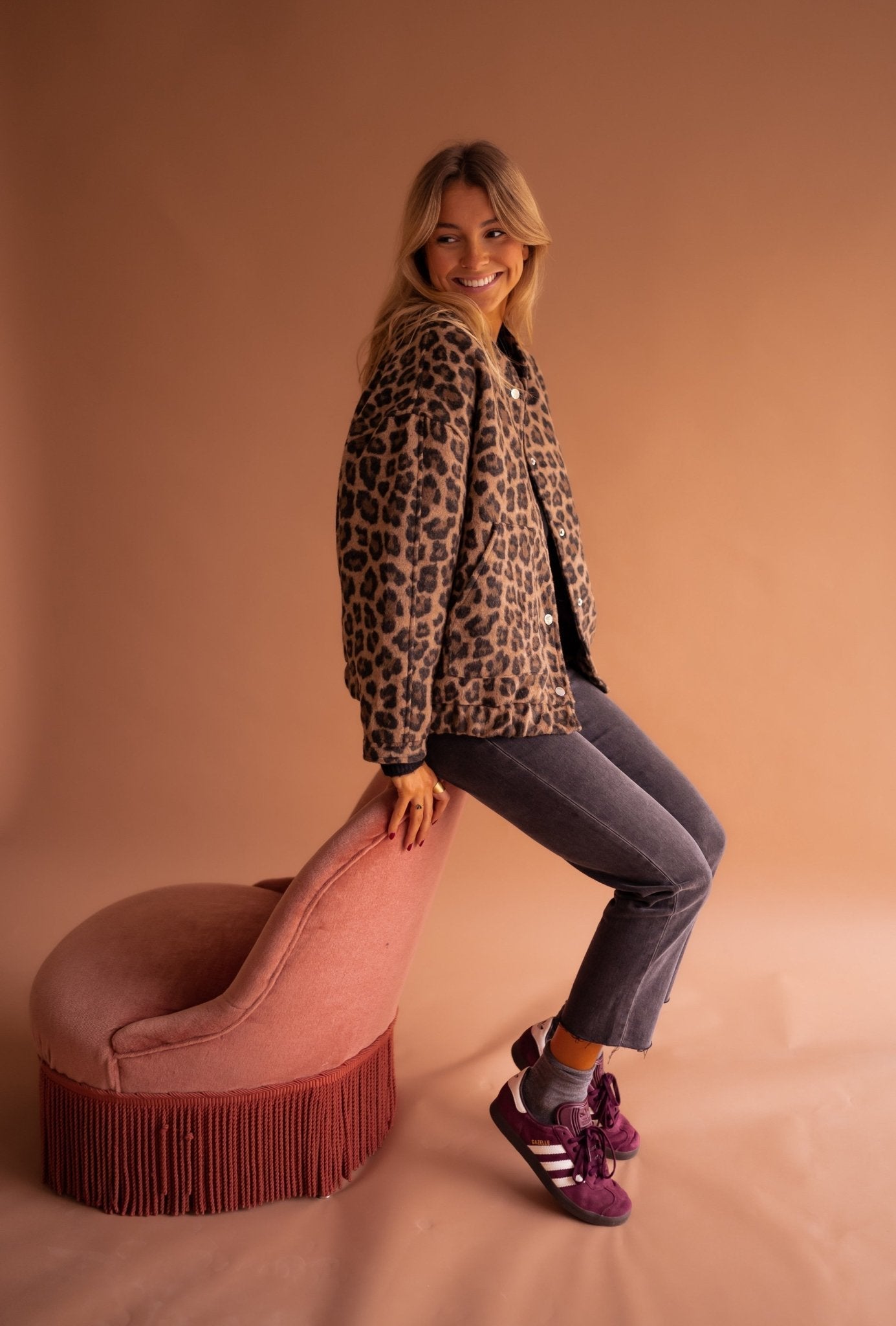 Women's leopard print jacket worn as a layering piece, relaxed everyday look