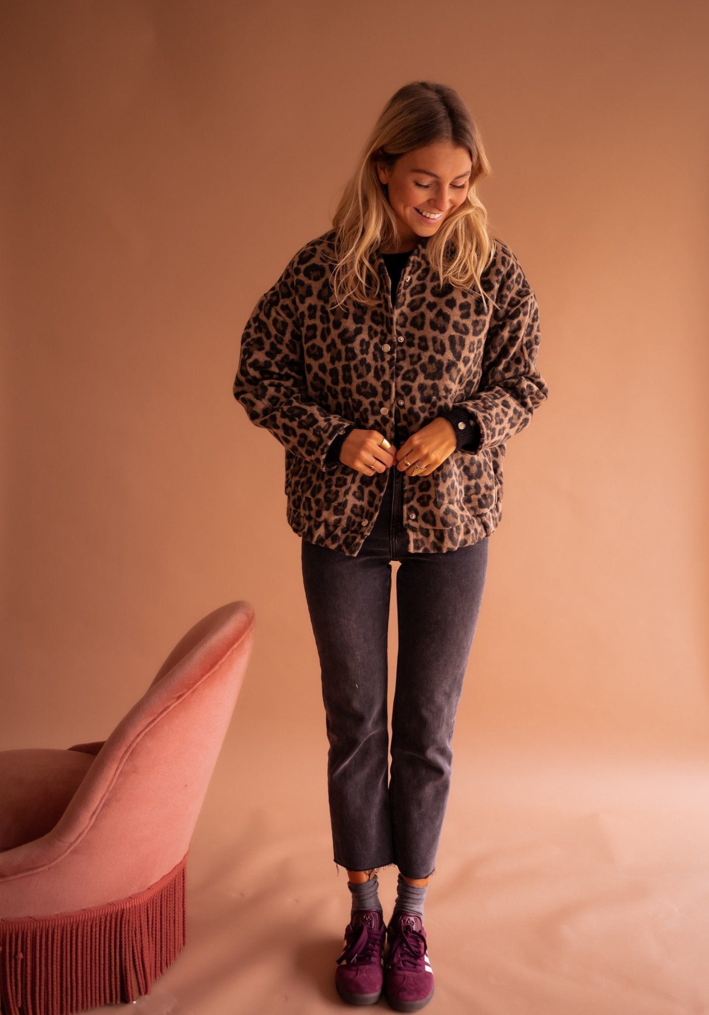 Women's leopard print jacket showing woven fabric texture and print detail