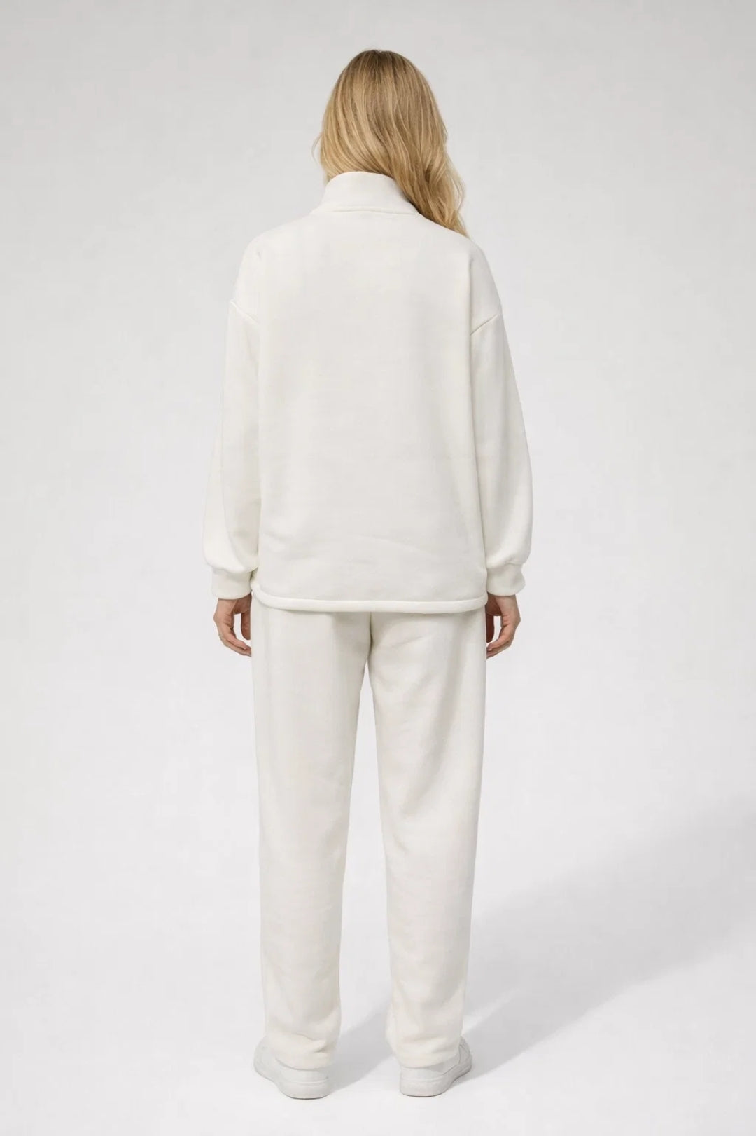 Half-zip lounge set for women featuring a high-collar top and relaxed straight-leg trousers