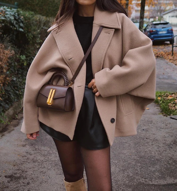 Oversized hip-length wool-blend coat for women with structured lapel collar