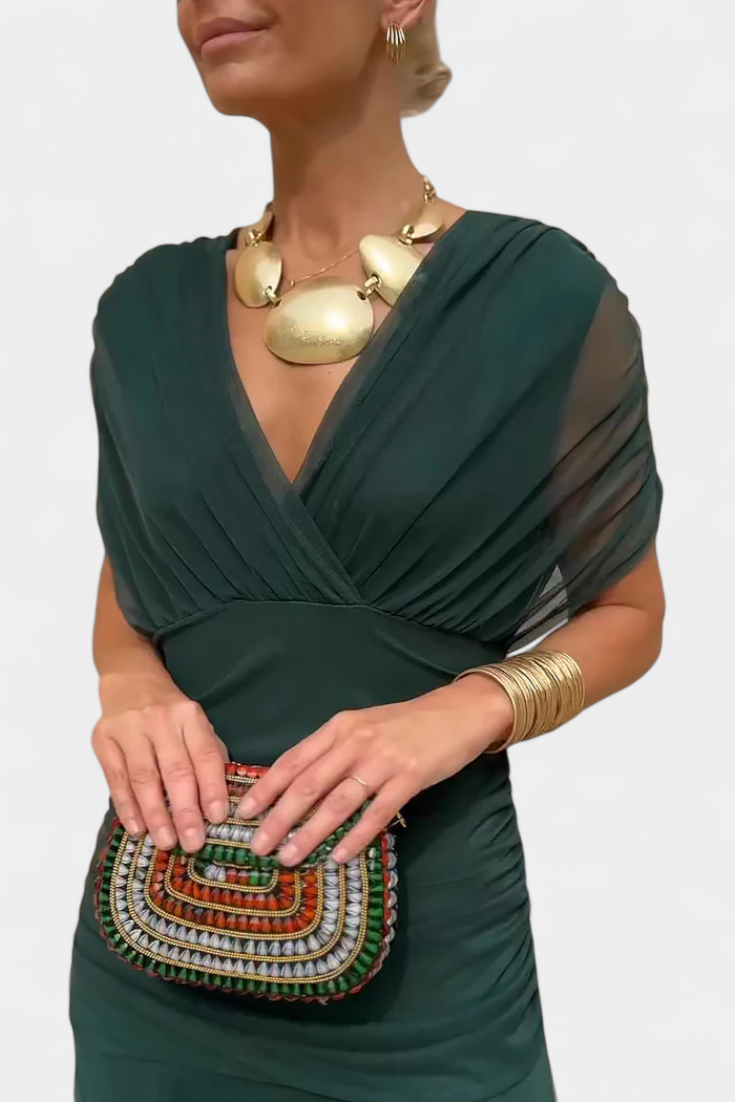 Women's off-shoulder maxi dress with draped bodice and figure-hugging silhouette