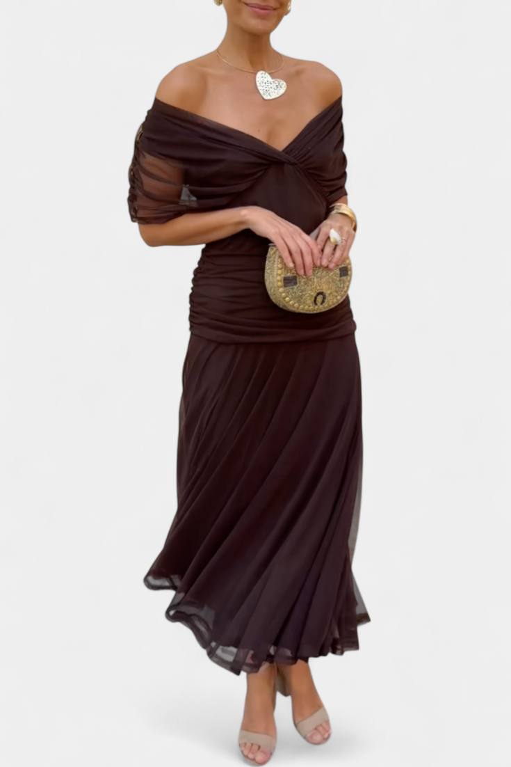 Women's maxi dress with off-shoulder neckline, twisted front detail, and draped skirt