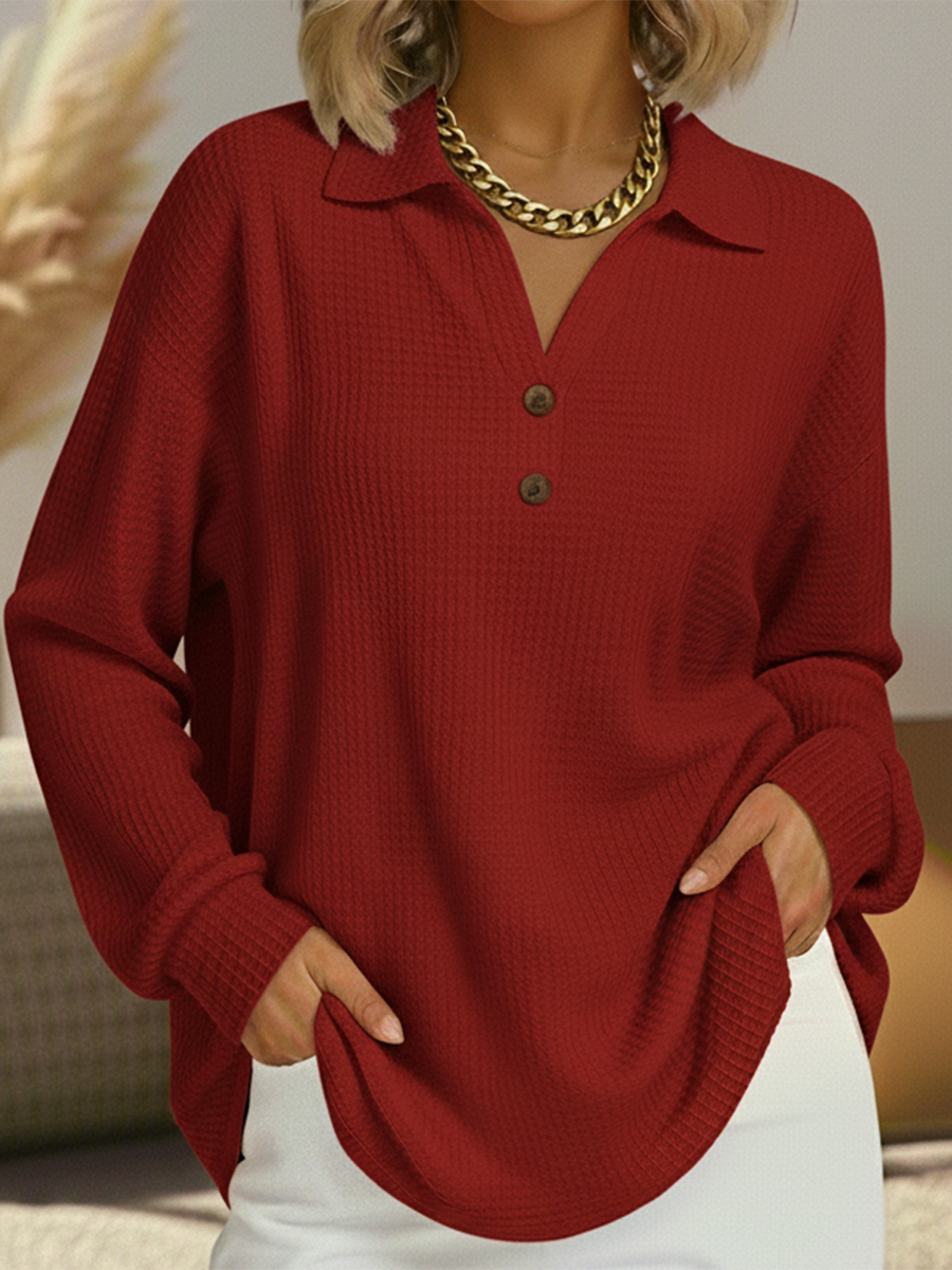 Long-sleeved women's blouse with partial button placket and fluid drape