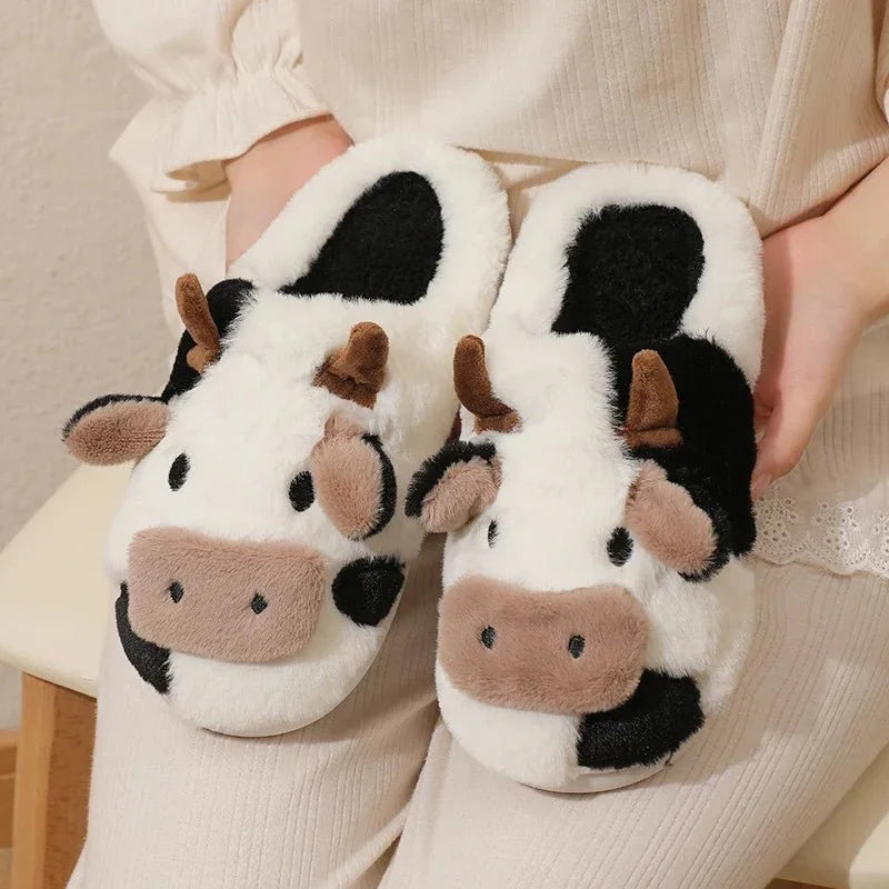 Soft plush indoor slippers with a slip-on entry and padded textile lining