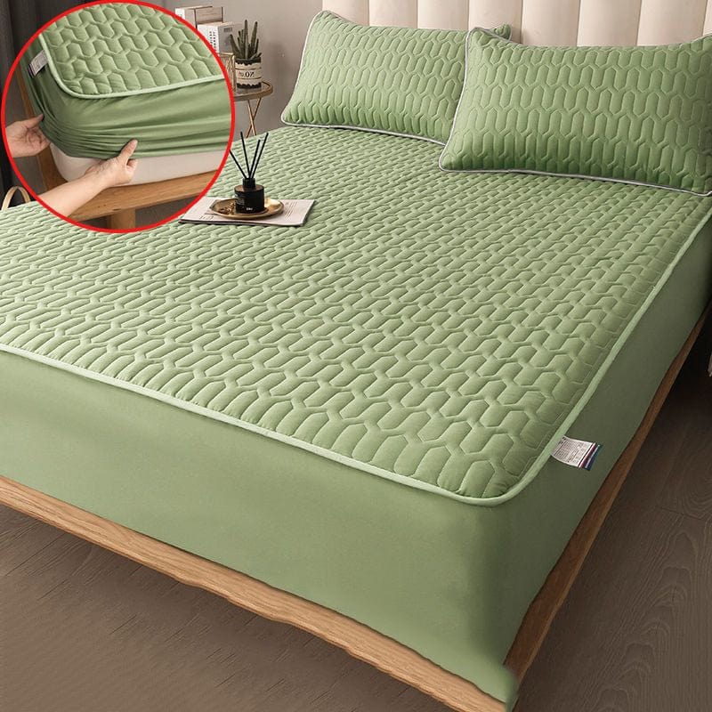 Side view of quilted mattress protector showing fitted elastic edge depth