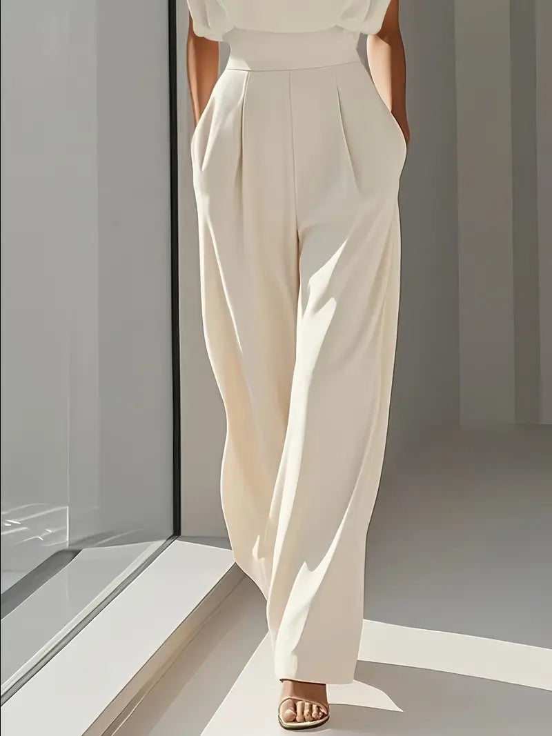 Full-length sleeveless jumpsuit with structured top and flowing wide-leg silhouette
