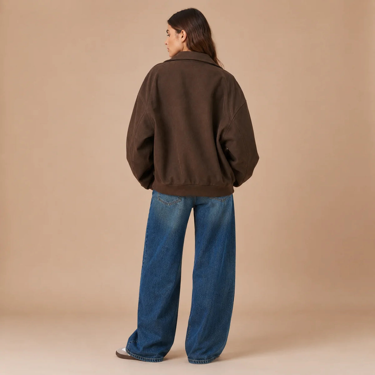 Back view of women's brown loose fit jacket with dropped shoulders