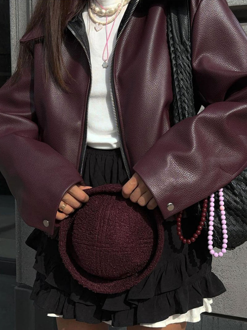 Faux leather women's jacket with structured silhouette and long sleeves