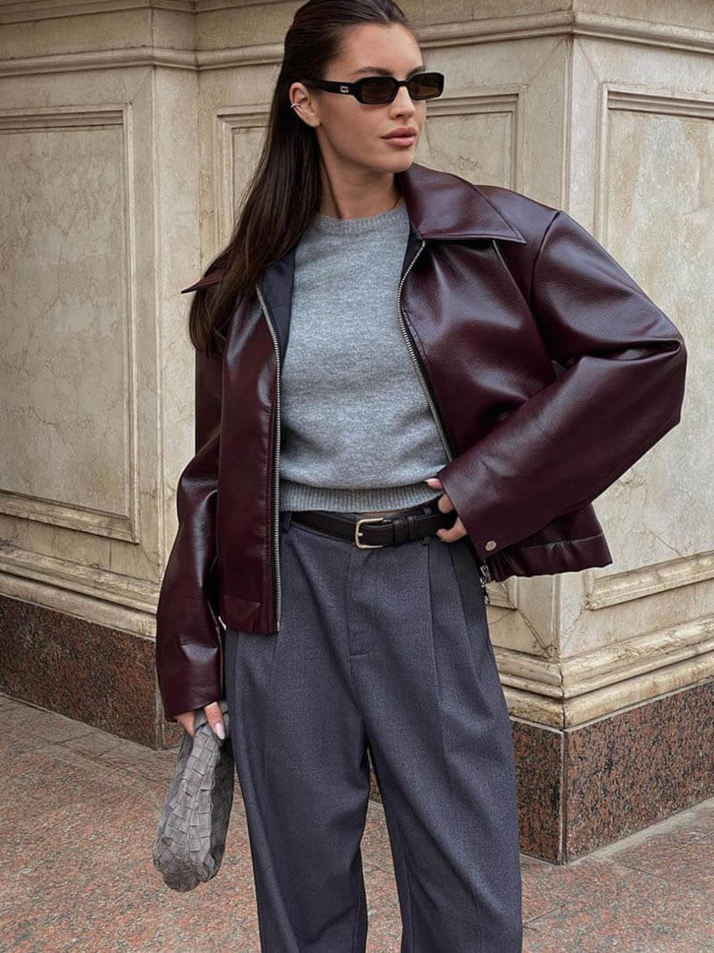 Straight-fit women's faux leather jacket with smooth surface and zipper closure